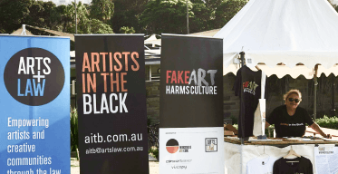 Photo of AITB Coordinator and Arts Law representative Bibi Barba showcasing all the services that AITB and Arts Law provide at the 2019 Yabun Festival